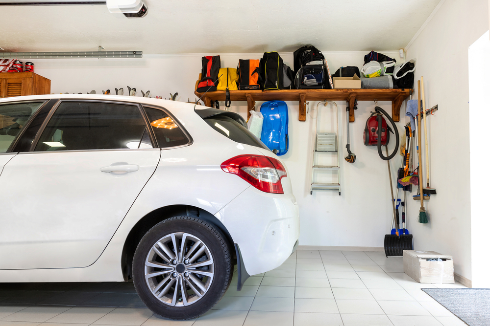 small white car parked in the garage